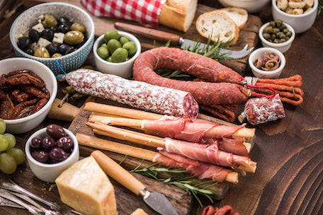 Italian charcuterie board with cured meats, aged cheeses, olives, and artisan crackers – perfect for entertaining or gifting