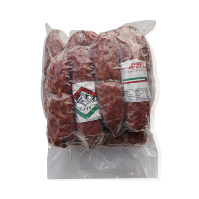 Alps Soppressata dry-cured salami sliced on wooden charcuterie board with herbs and cheese