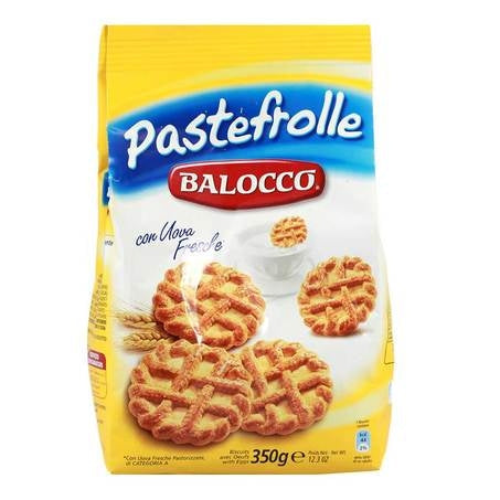 Balocco Italian cookies and panettone displayed on rustic wooden table