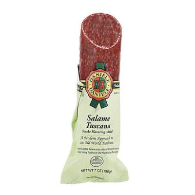 Del Duca prosciutto and Italian salami arranged on a rustic charcuterie board