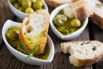 Premium imported Italian and French olive oils in glass bottles – extra virgin, cold-pressed, and artisanal varieties