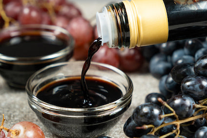 Assorted bottles of gourmet vinegar including balsamic, wine, and fruit varieties – premium imported vinegars from Italy and France